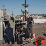 Cold Cloud technicians repairing a rooftop package unit in Los Angeles