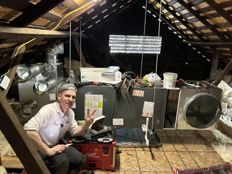 Cold Cloud technician installing an air handler in an attic