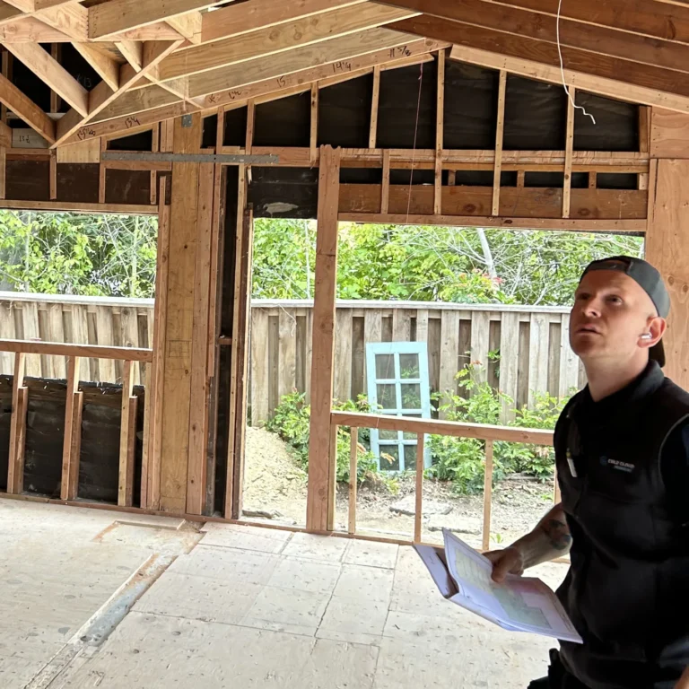 Cold Cloud technician reviewing HVAC plans at a home remodel