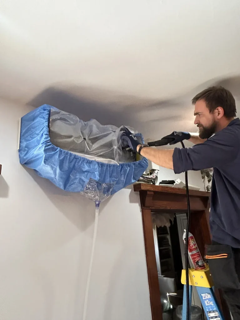 Cold Cloud technician deep-cleaning a ductless mini-split indoor unit