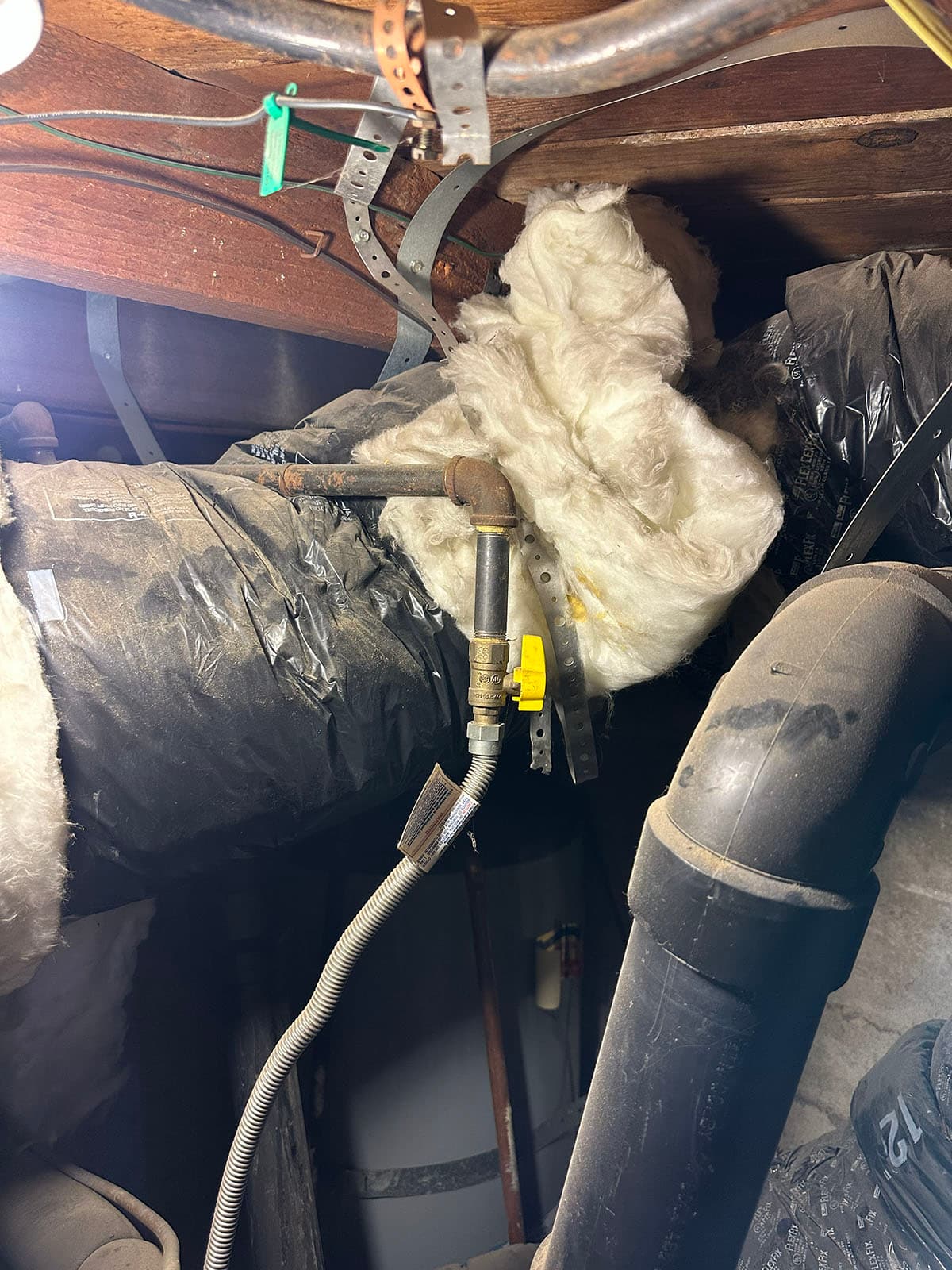 Old attic HVAC ductwork before system upgrade in Sierra Madre