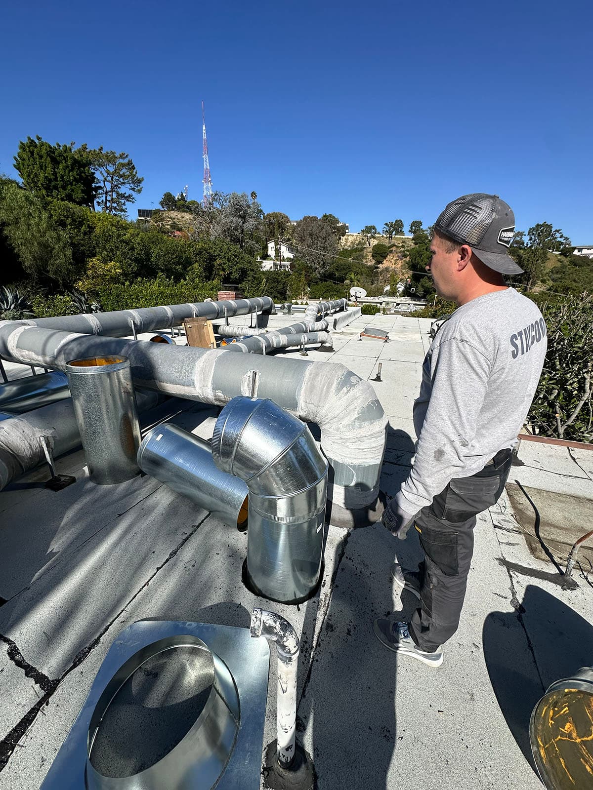 Cold Cloud technician performing rooftop duct rebalance in West Hollywood
