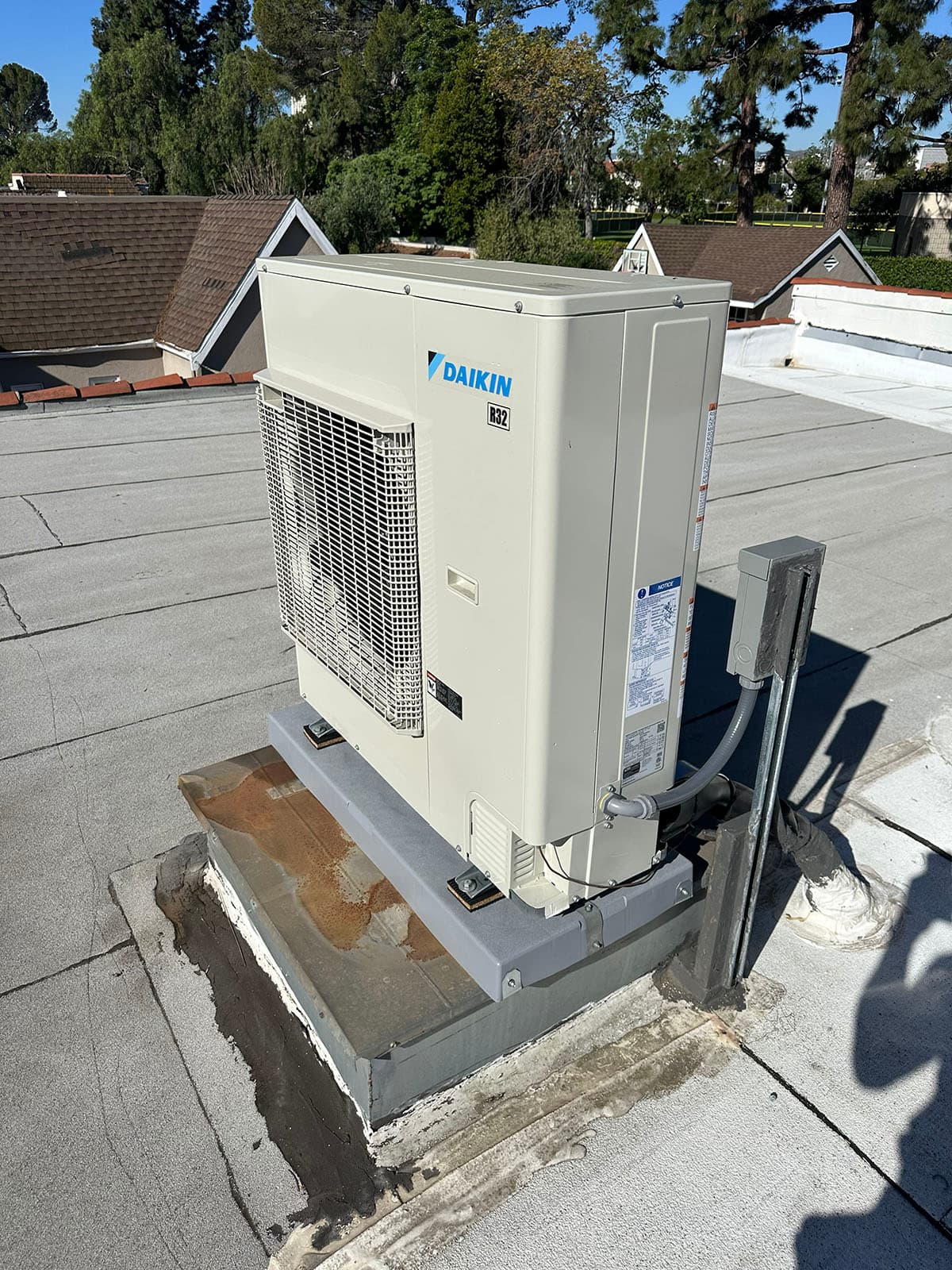 Daikin rooftop heat pump system installed on a flat roof in Sierra Madre