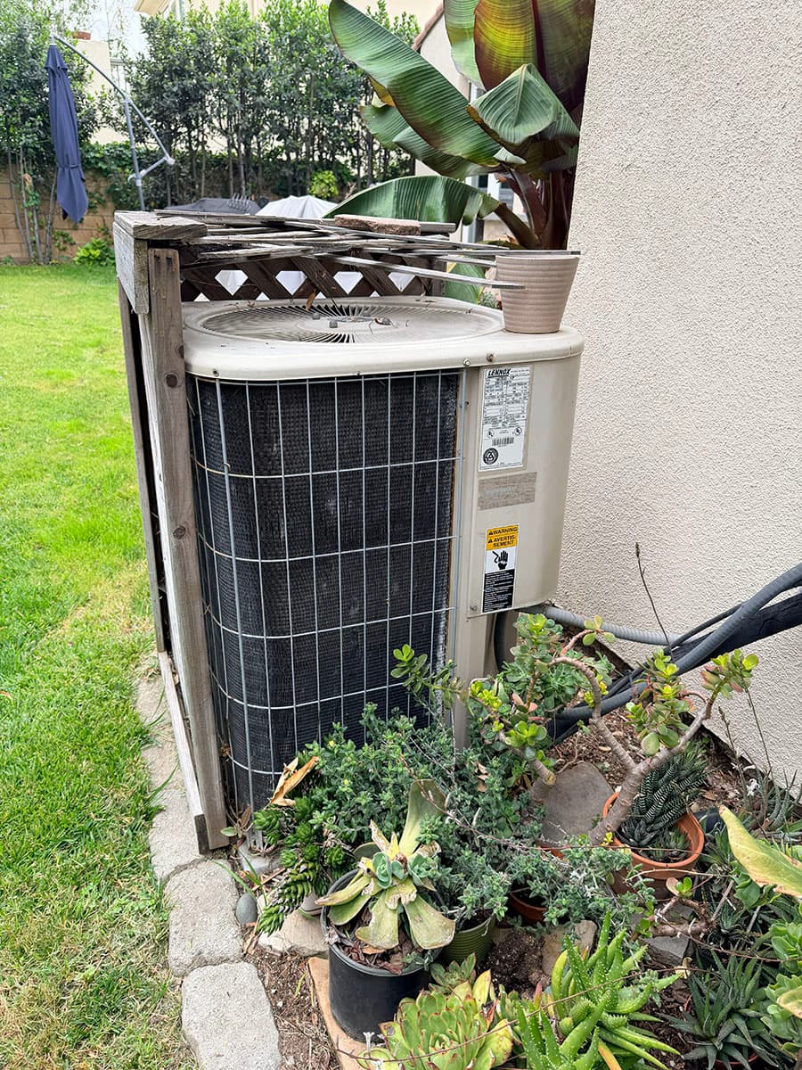 Existing outdoor HVAC unit before wildfire rebuild replacement in Altadena