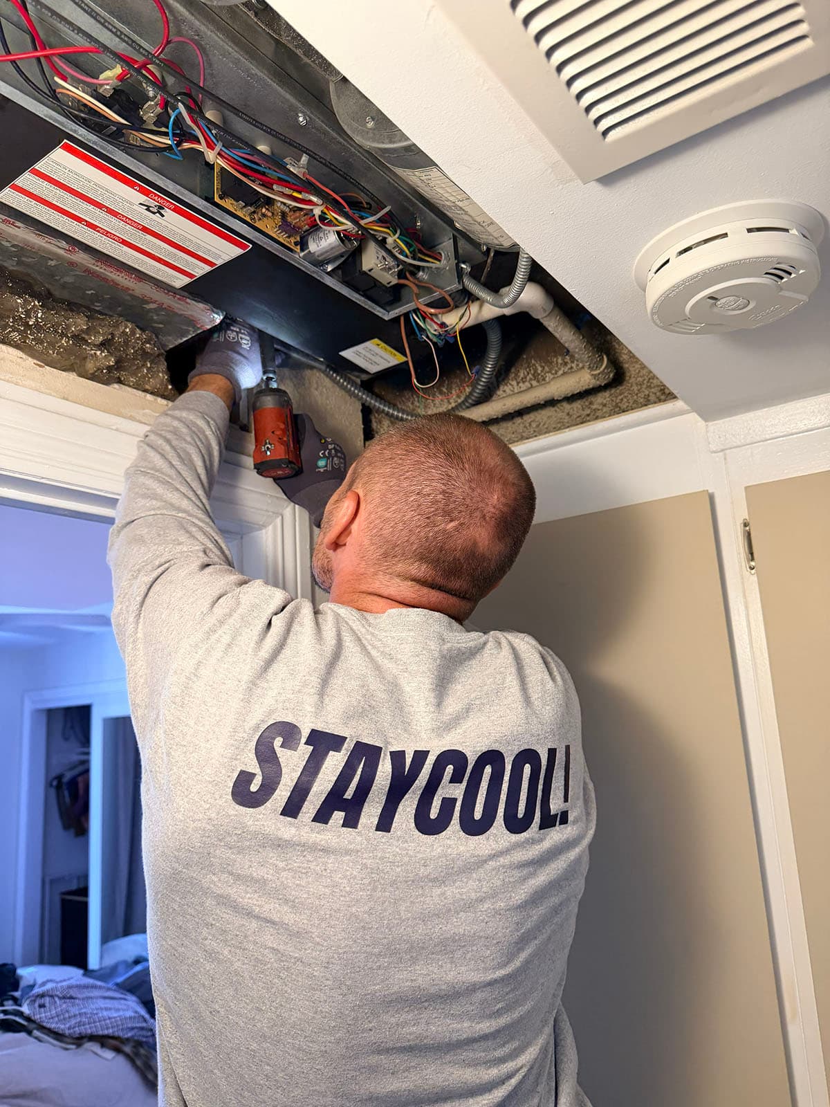 First Company ceiling mount fan coil installation First Company ceiling mount fan coil installation in Pasadena condo