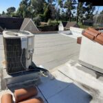 Outdoor mini split condenser unit installed on a Los Angeles rooftop