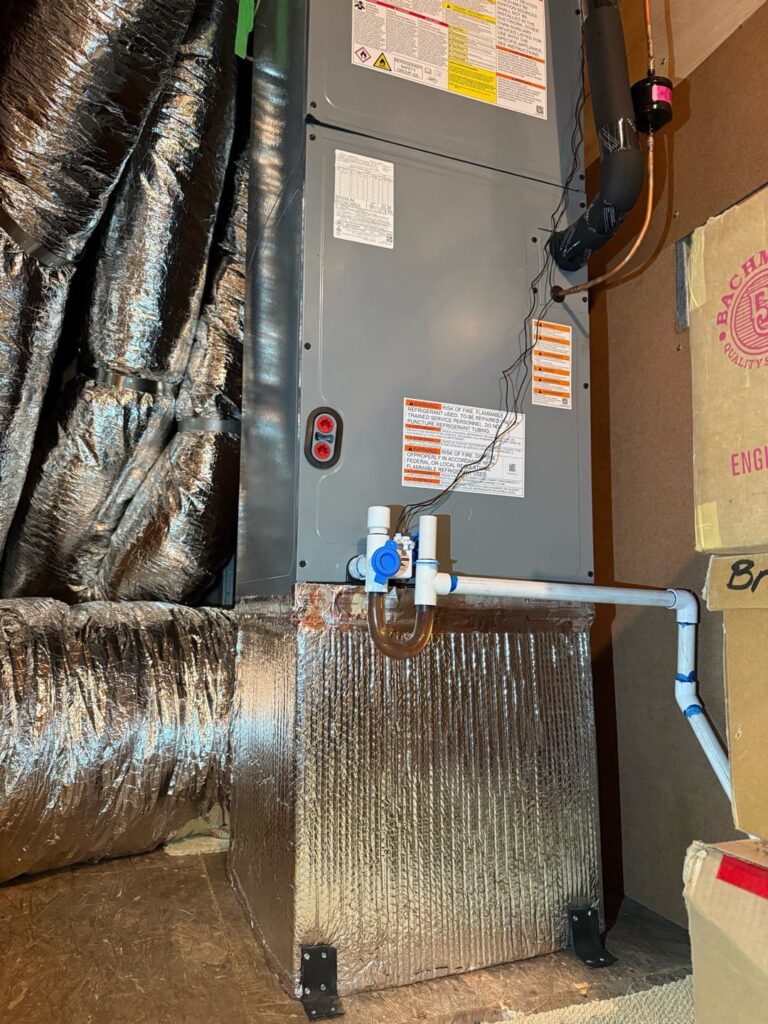 Attic ductwork wrapped in insulation, a common check when air isn't reaching certain vents