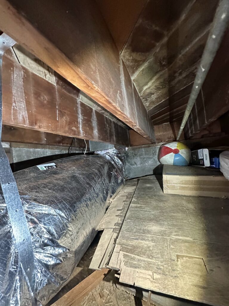 Checking the evaporator coil when an AC unit is not blowing air Indoor air handler and evaporator coil enclosure in a Los Angeles attic installation