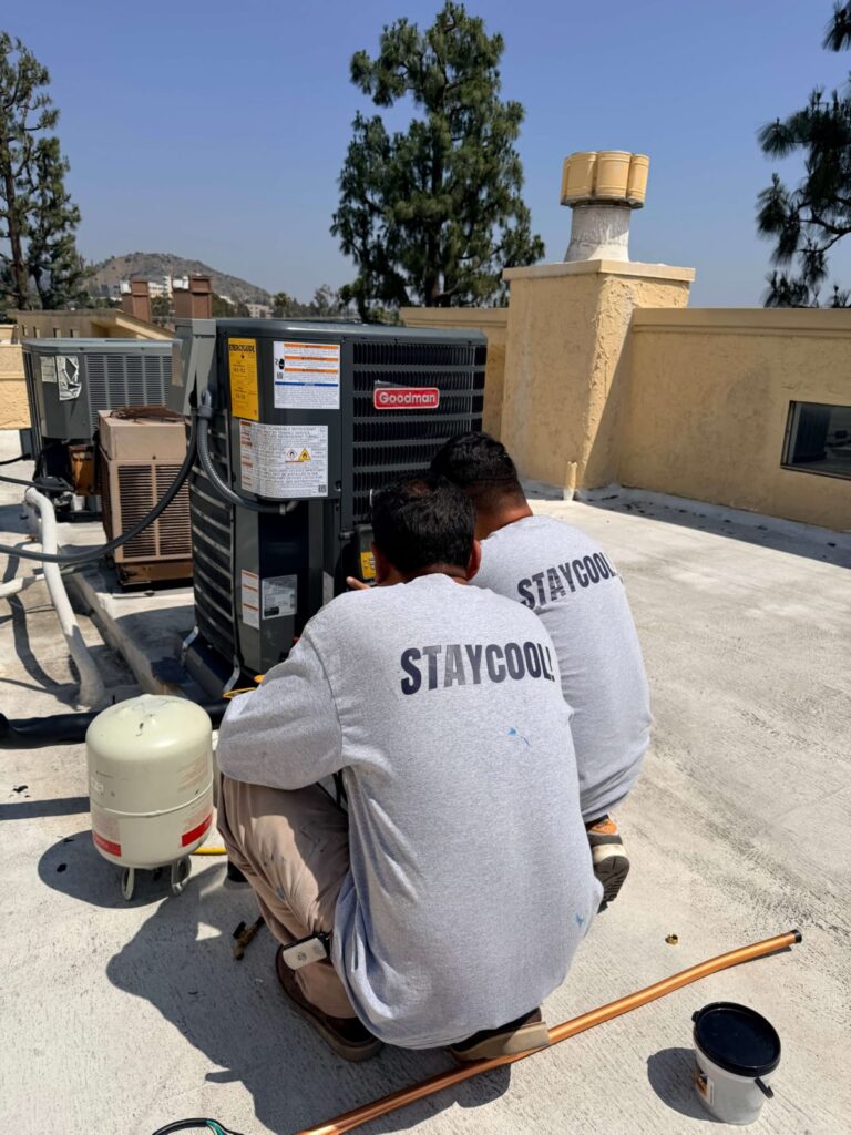 Professional AC repair when troubleshooting doesn't restore airflow Licensed HVAC technician repairing an outdoor AC unit in Los Angeles