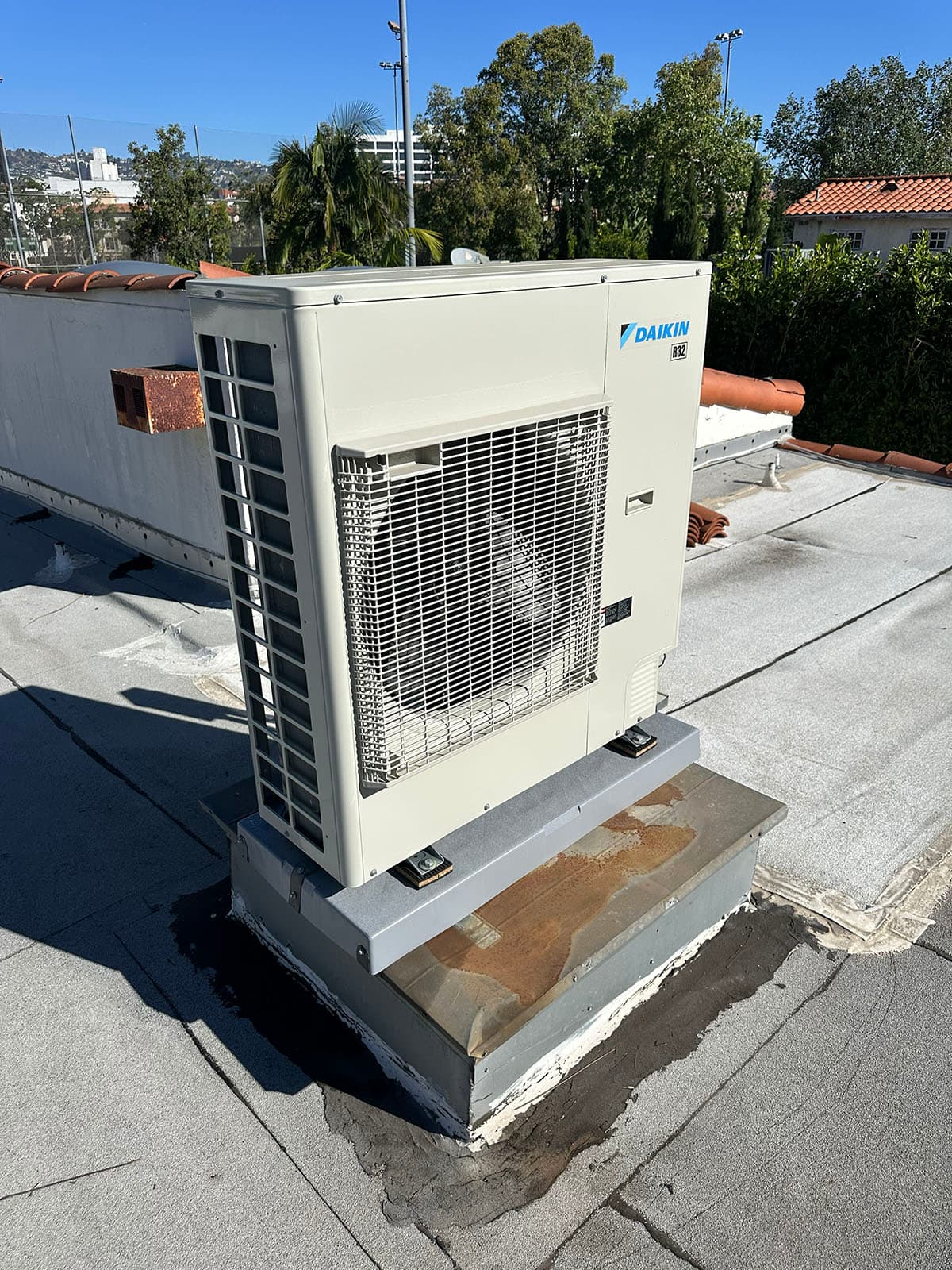 New Daikin rooftop HVAC unit installation on flat roof