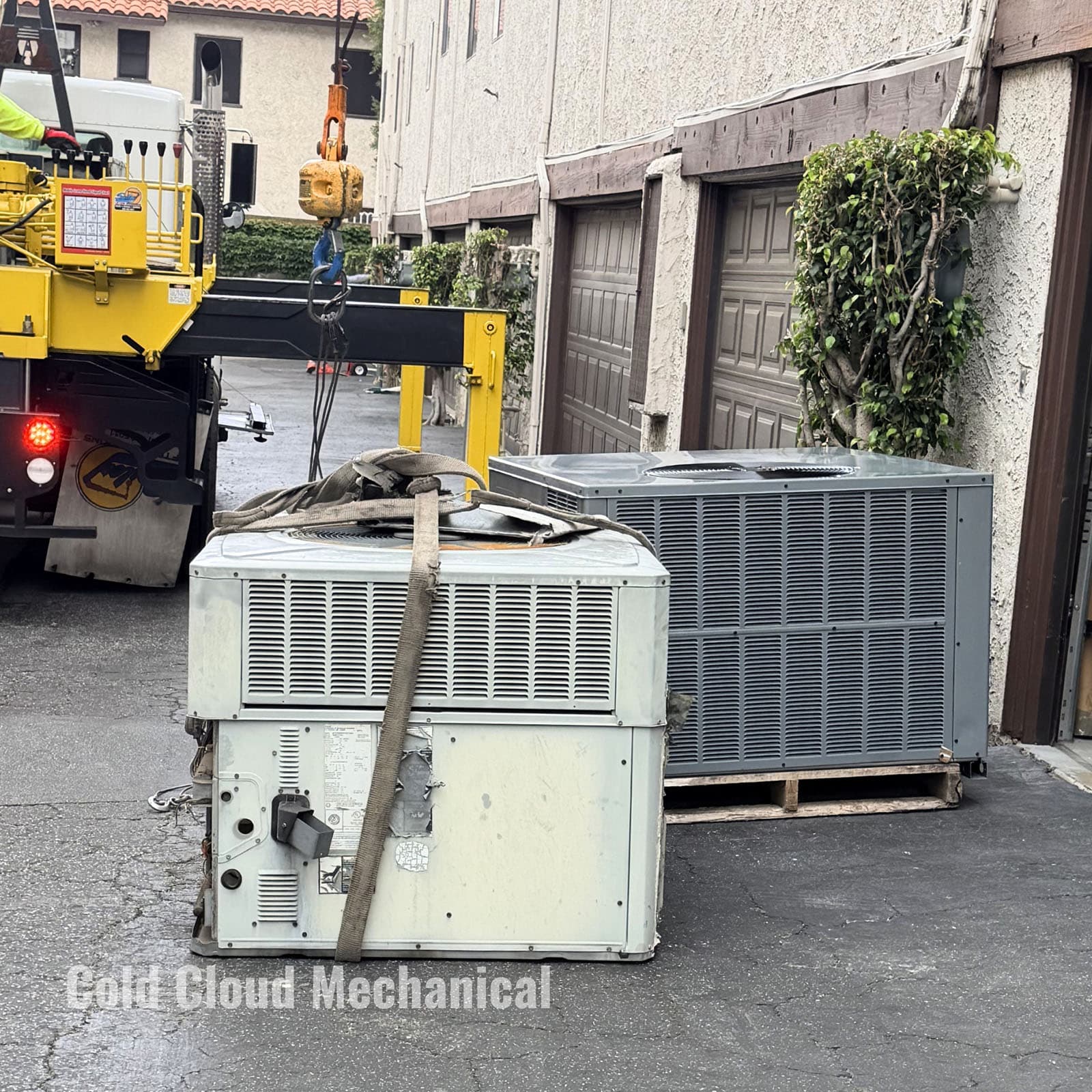 Old and new rooftop HVAC units staged before Daikin installation in Pasadena