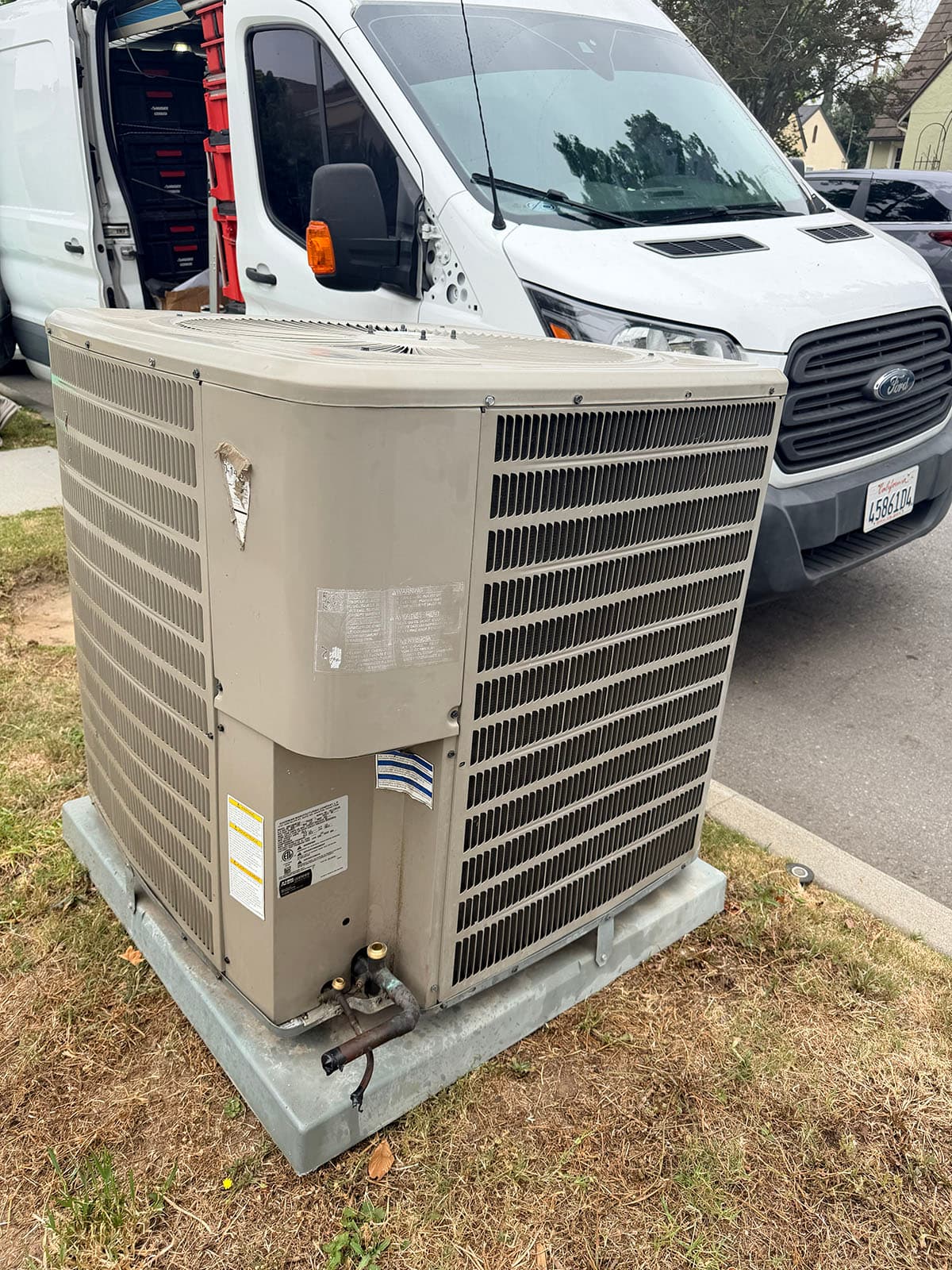 Old HVAC condenser removed before Daikin install in Alhambra