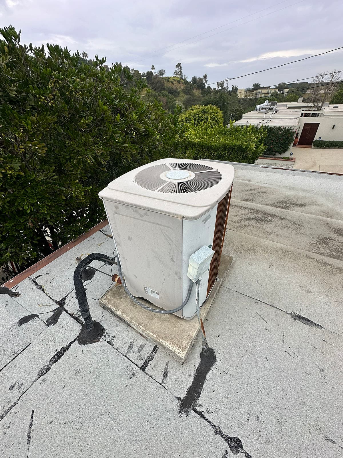 Old outdoor HVAC unit before Daikin Fit upgrade
