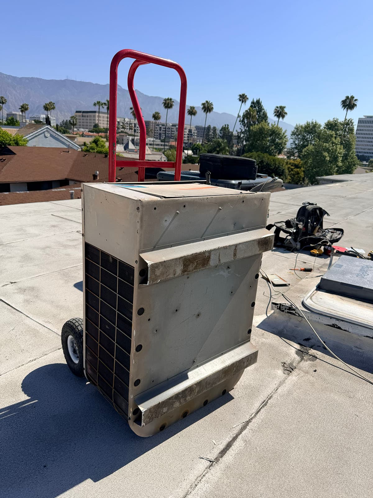 Old rooftop condenser before heat pump split installation in Pasadena
