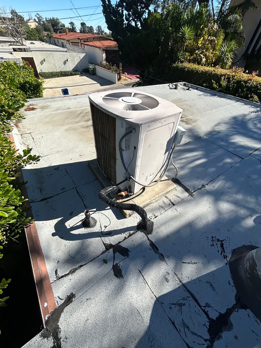 Old single-stage rooftop HVAC unit before replacement in West Hollywood