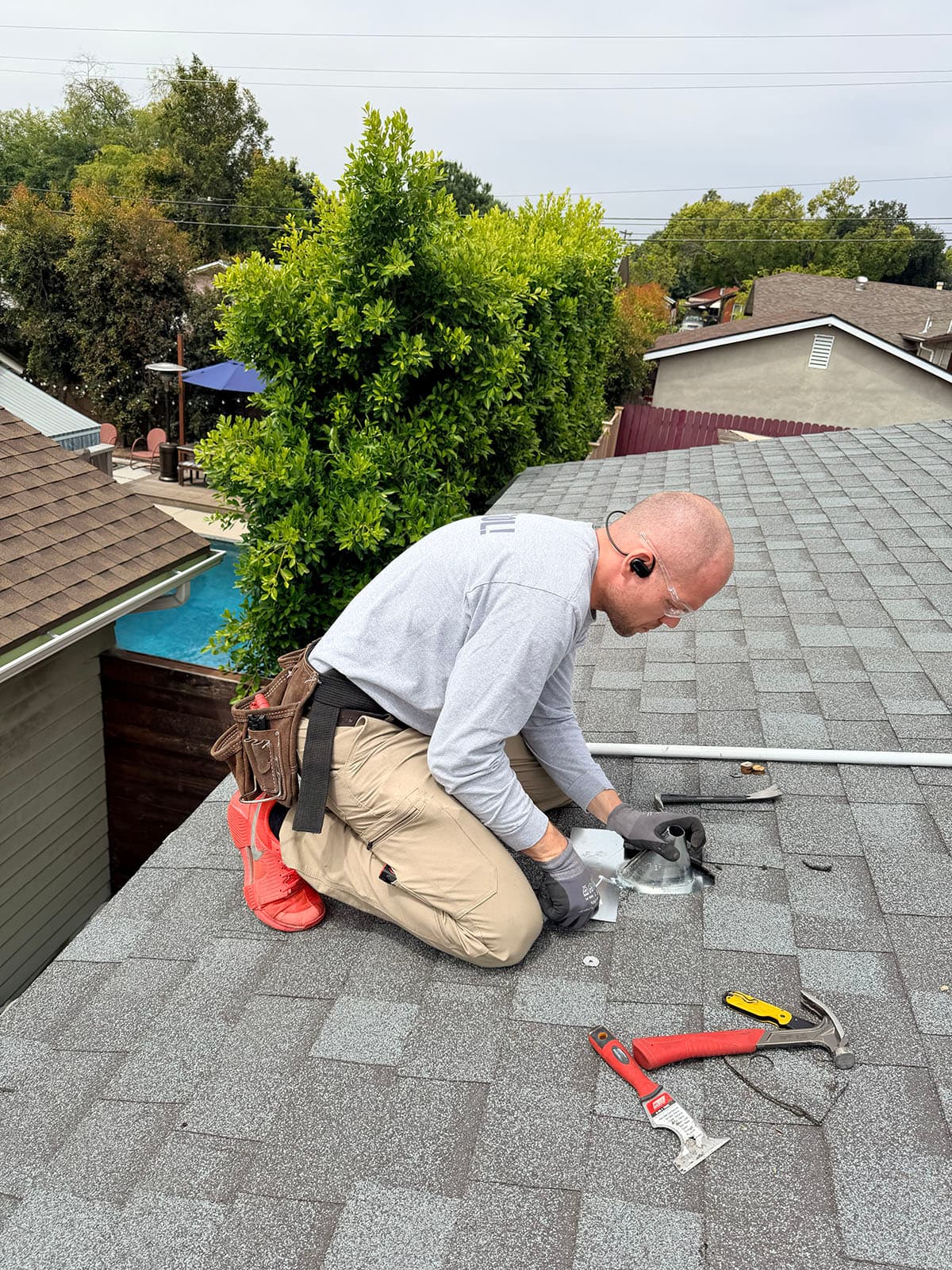 Technician preparing roof curb for Daikin RTU installation