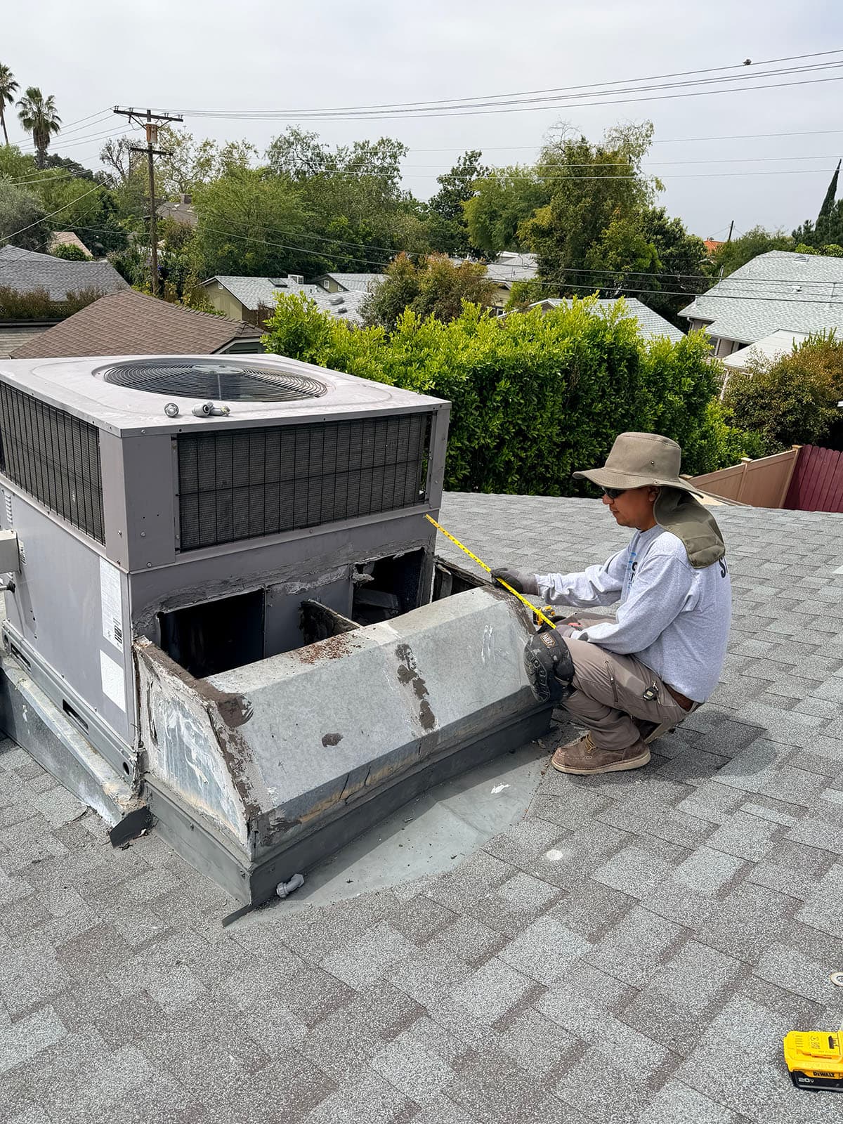 Technician removing old rooftop package unit in Pasadena