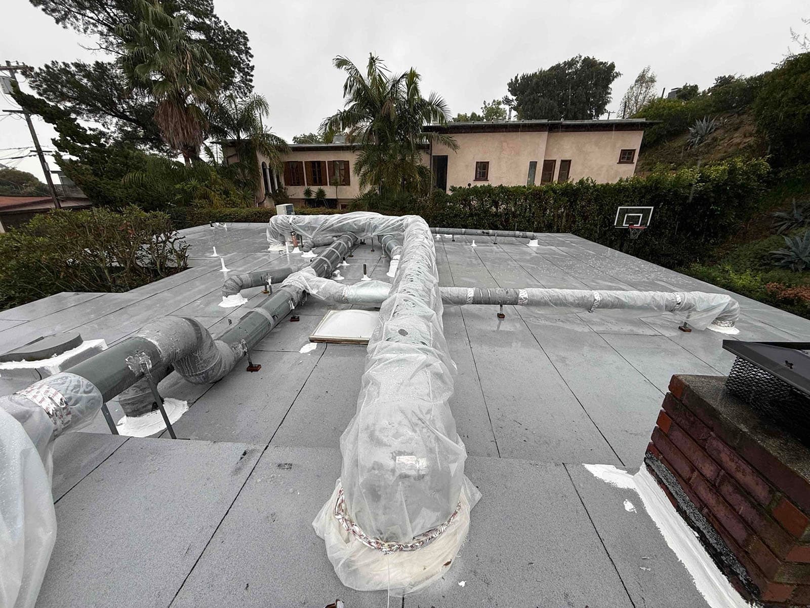 West Hollywood rooftop duct reseal before rebalance