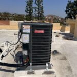3 ton outdoor HVAC condenser unit installed on rooftop pad in Los Angeles