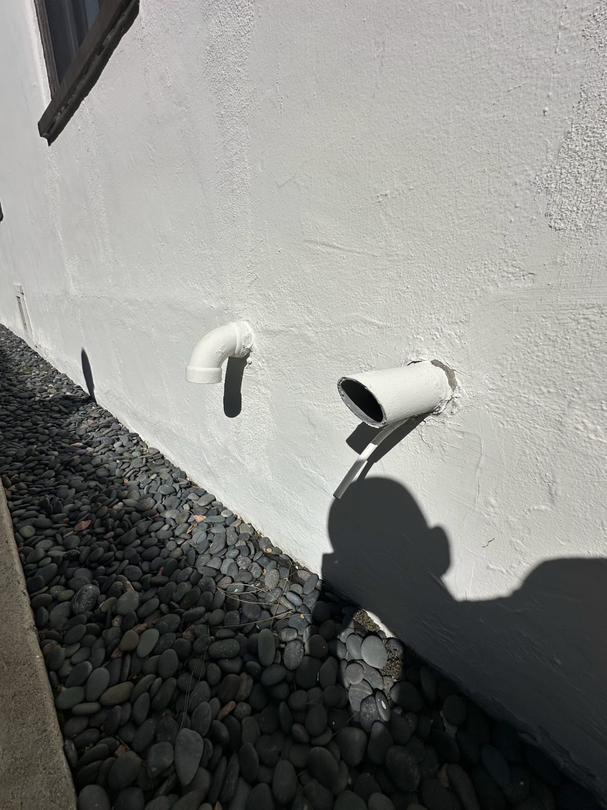 Outdoor airflow vent affecting system performance Exterior wall vent cap on stucco home, Los Angeles