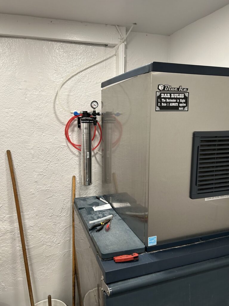 Commercial ice machine with a water filter installed