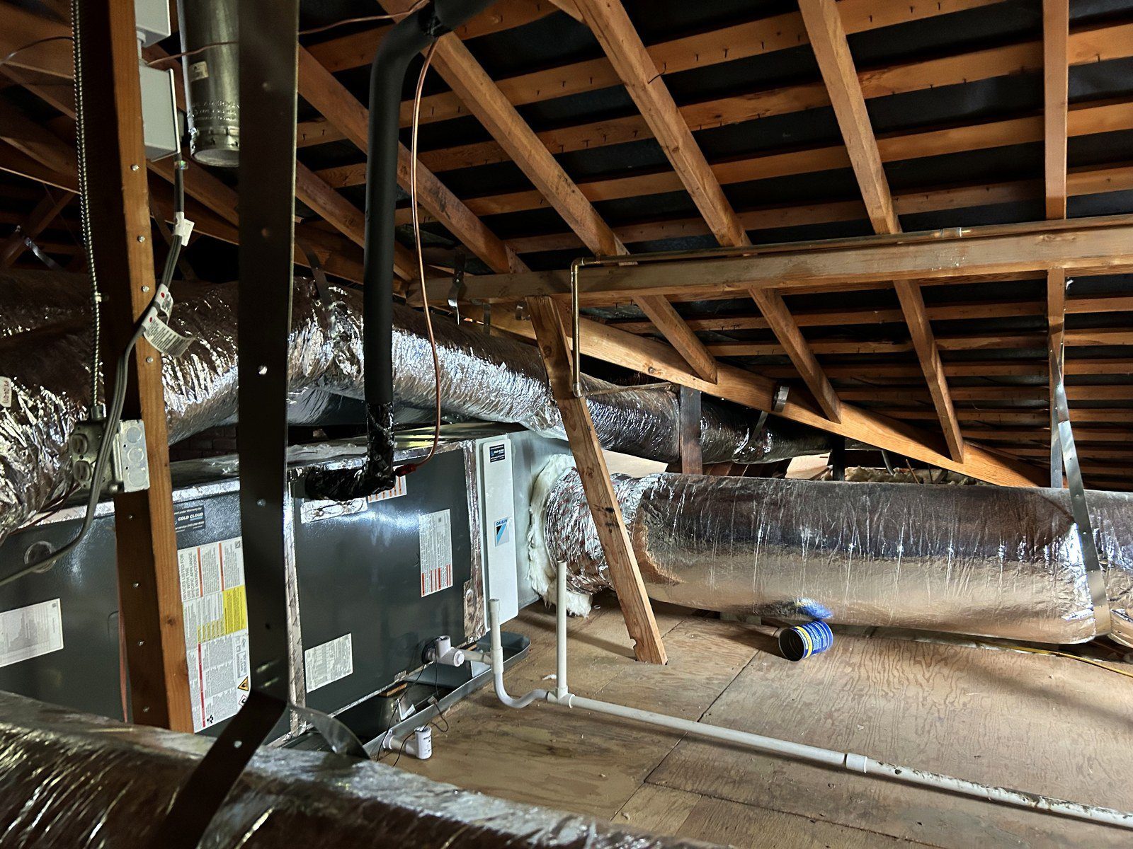 New Daikin air handler in the attic with new insulated ductwork hung on straps off the attic floor in Altadena, CA 91001