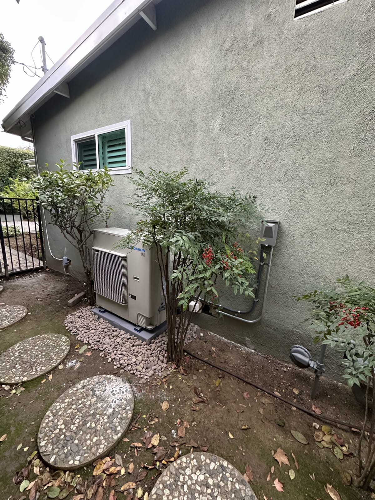 High-efficiency air-source heat pump outdoor unit installed at residential property