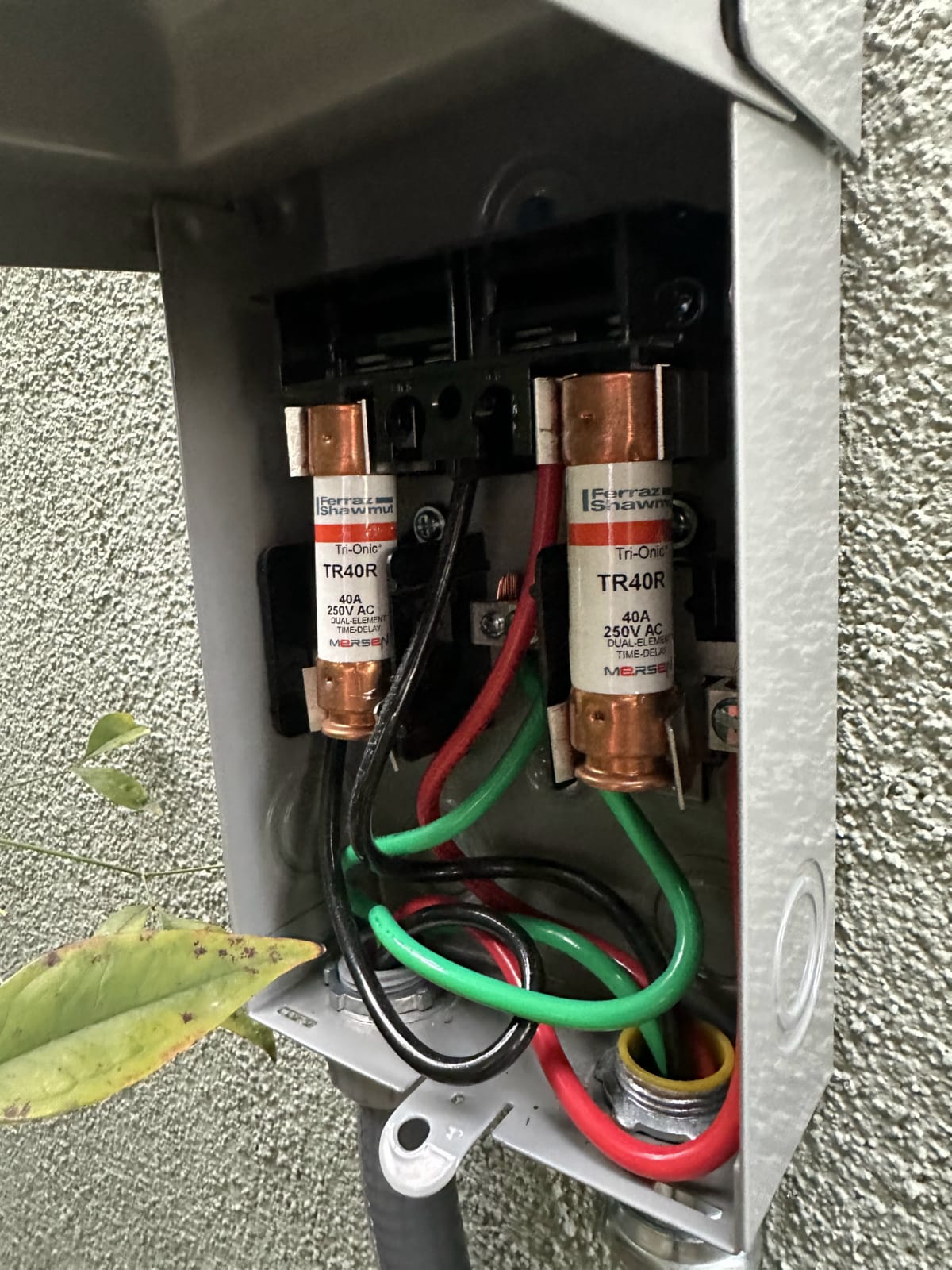Electrical connection check during HVAC maintenance visit Close-up of electrical wiring connections inside HVAC junction box