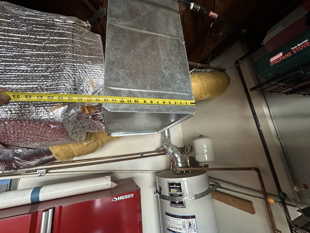 Ductwork inspection before dehumidifier installation Insulated HVAC ductwork in garage ceiling ahead of dehumidifier tie-in
