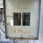 Residential electrical panel assessed before heat pump installation