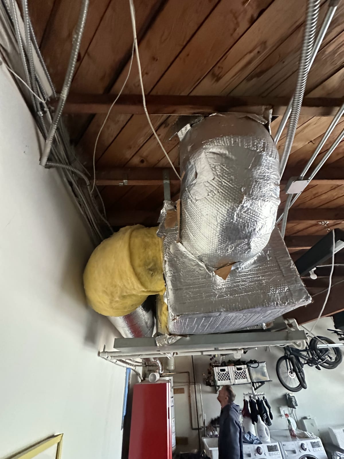 Attic ductwork insulation ahead of humidifier installation Insulated attic ductwork prepared for humidifier installation tie-in