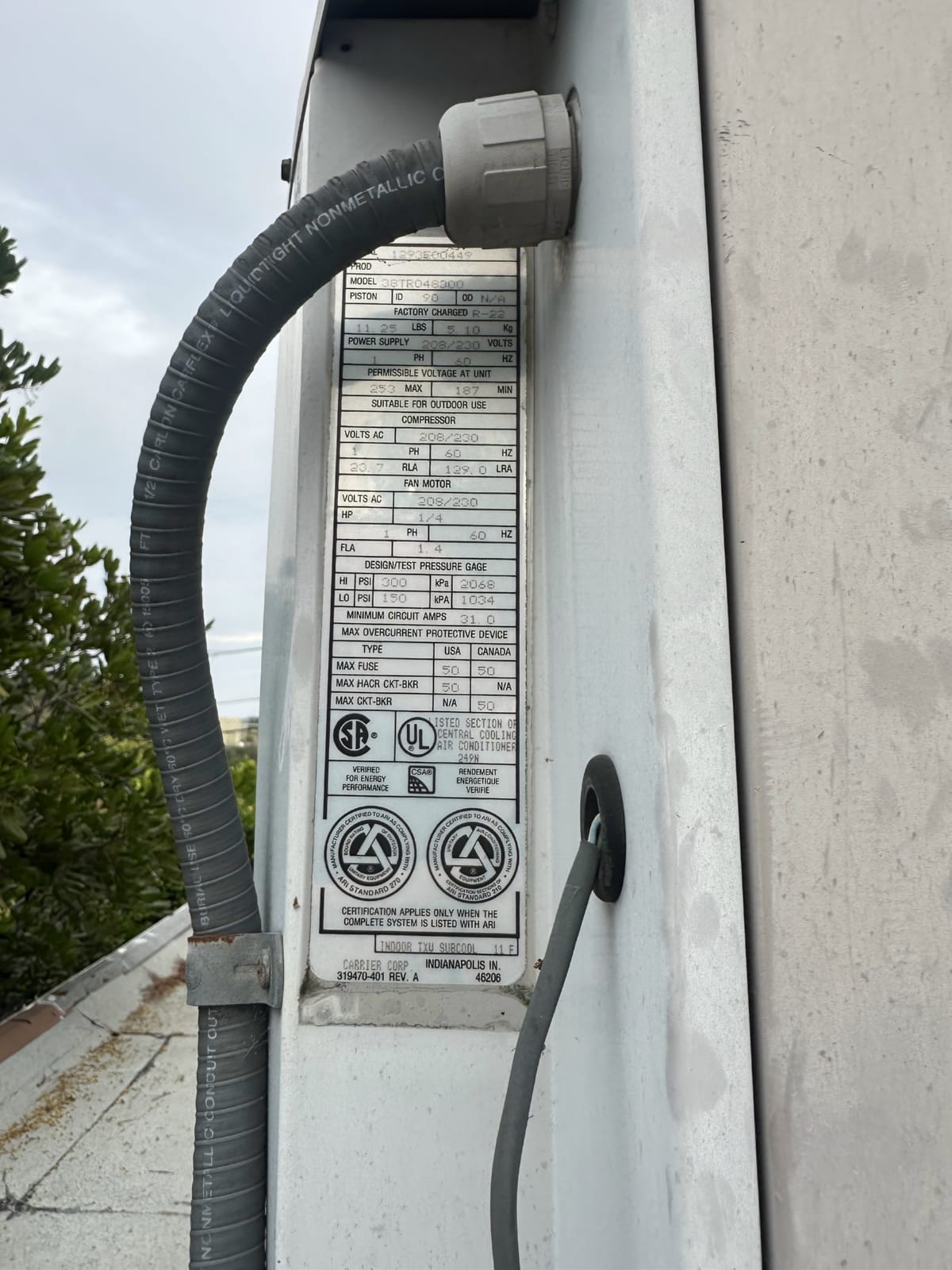Outdoor HVAC refrigerant line connection point with weatherproof fitting