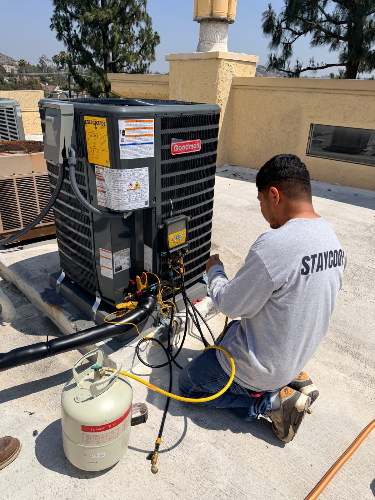 Outdoor AC condenser unit on concrete pad ready for seasonal inspection