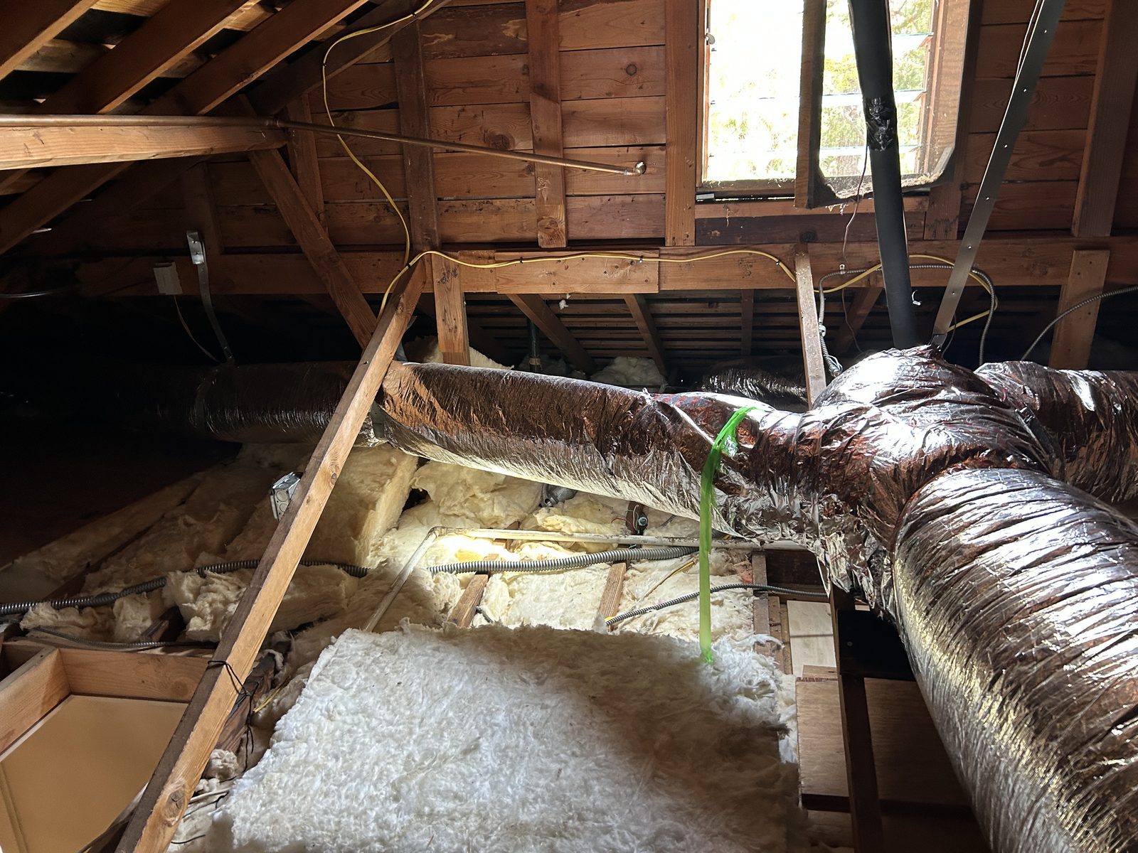 New insulated duct runs suspended off the attic floor on supports in Altadena 91001