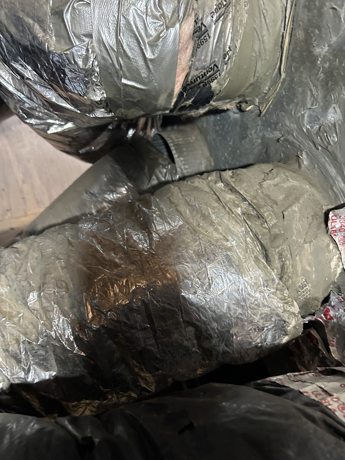 Smoke staining on the old flex duct jacket after the Eaton Fire in Altadena 91001